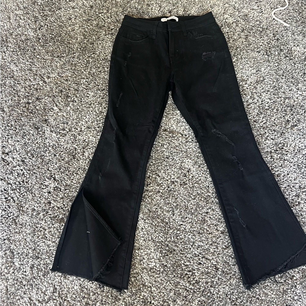 black flared flying monkey size 25 jeans, frayed slit at the bottom